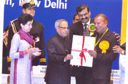 Mr. J.L. Kaul receiving the Best Braille Press Award from the President of India on 6th February, 2013