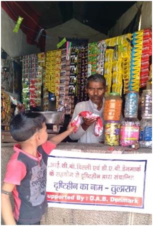 Tularam selling chips packets to a little boy
