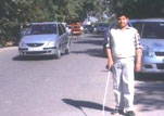 Image of A newly blinded person learning mobility skills.