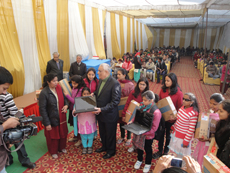 P.K. Pincha distributing laptops