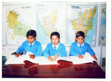 Students reading Braille