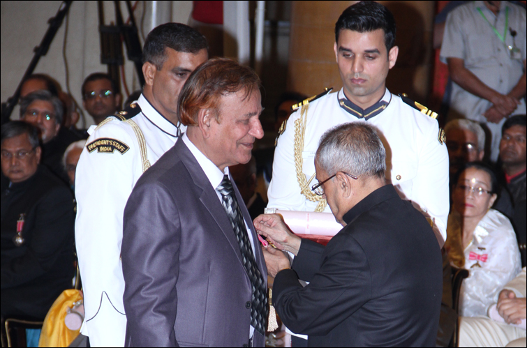 President of India Sri Pranab Mukherjee pinning medal to J L Kaul after receiving  Padma Shri award